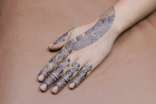 A close-up of a hand with intricate mehndi designs showcasing cultural artistry.